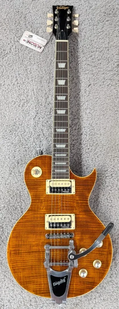 Vintage V100 ReIssued LP Electric Guitar with Bigsby Tailpiece ~ Flamed Amber